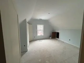 a view of empty room with windows