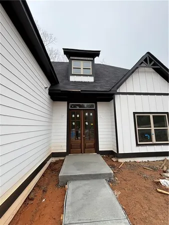 a front view of a house with garage