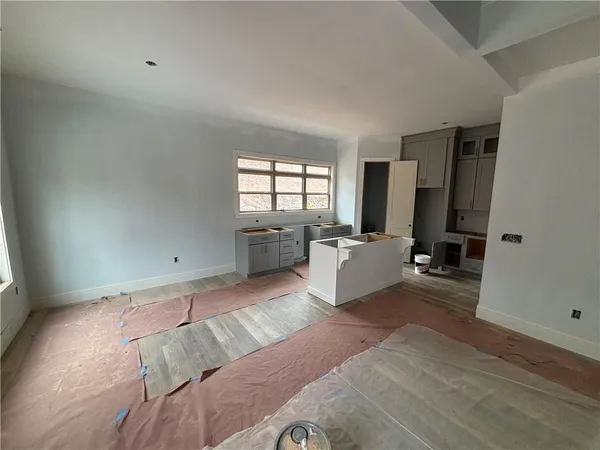 a large room with a large window and a couch