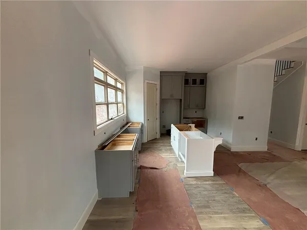 wooden floor with furniture and window
