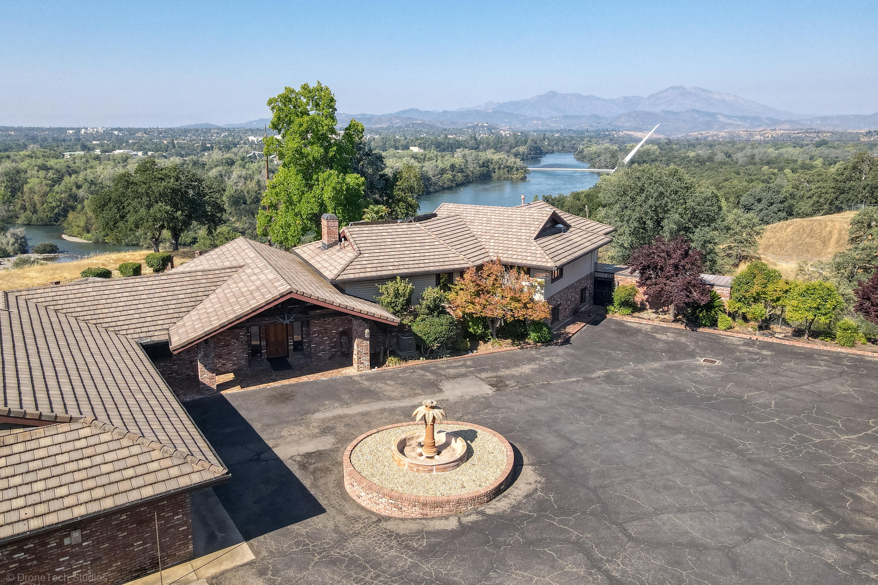 910 River Bend Road Redding, CA 96003 - Photo 2 of 92 an aerial view of a house with a yard and balcony