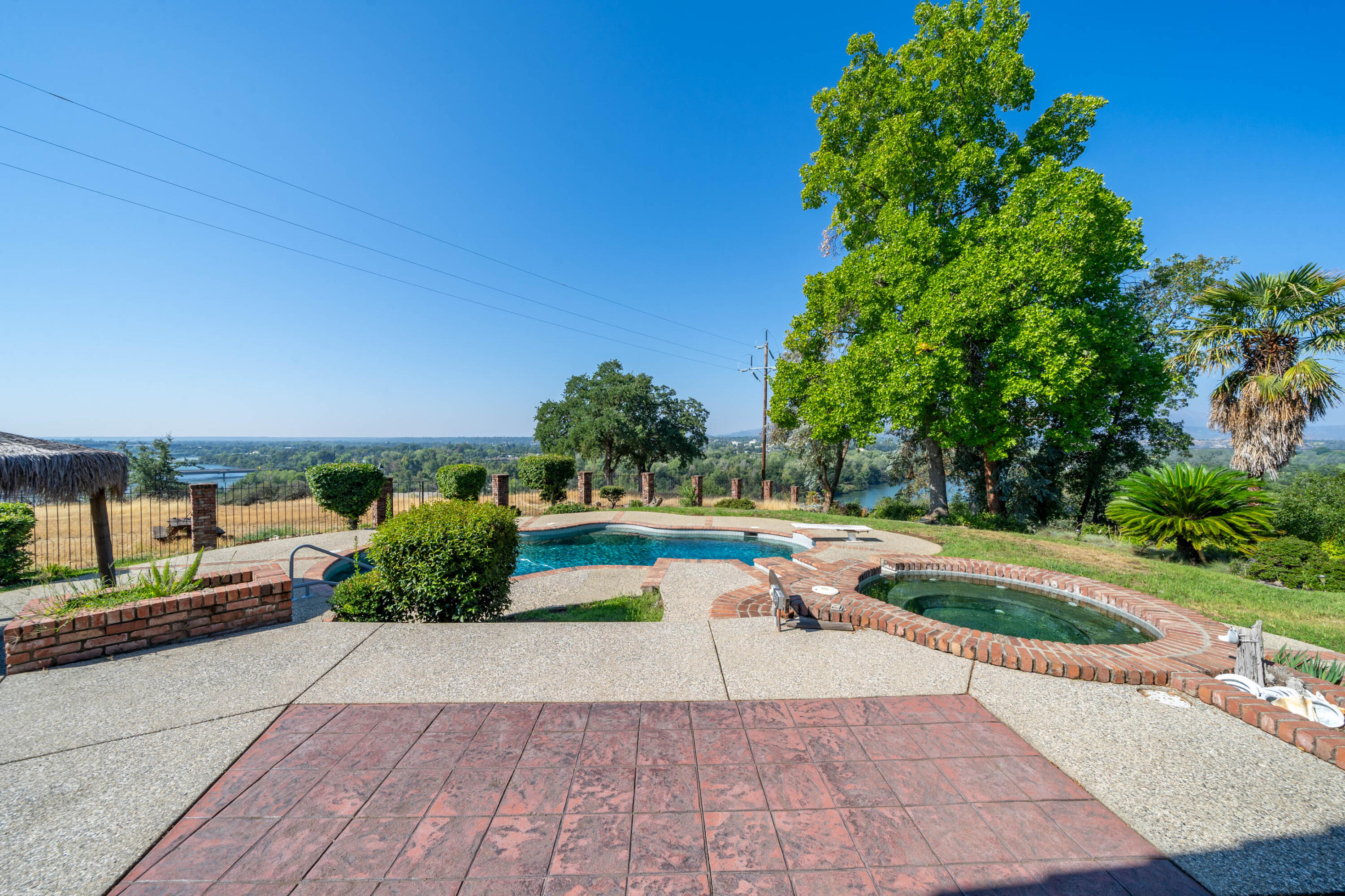 910 River Bend Road Redding, CA 96003 - Photo 22 of 92 a view of a patio with couches and table and chairs and potted plants