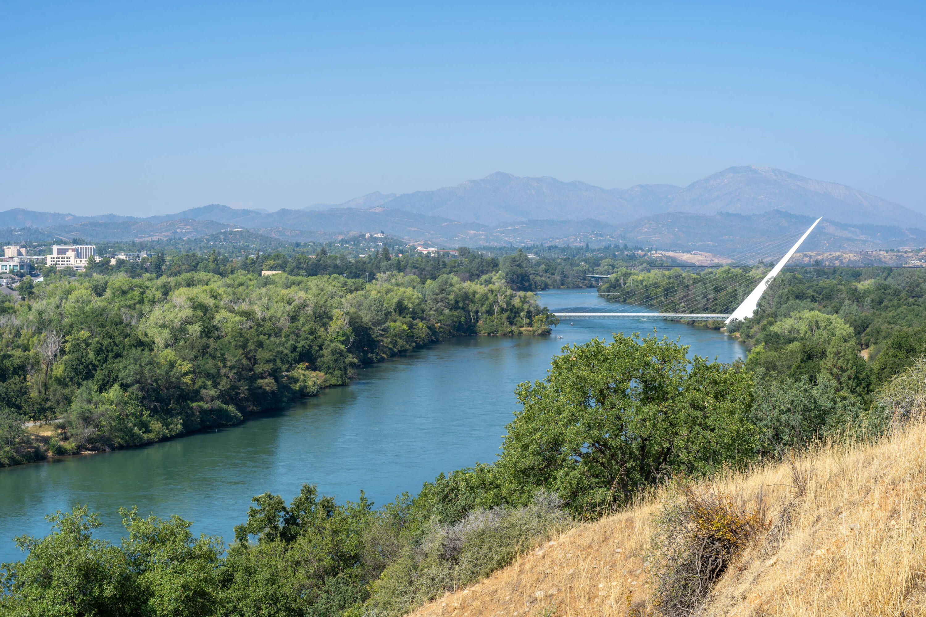 910 River Bend Road Redding, CA 96003 - Photo 3 of 92 an aerial view of residential house with outdoor space and lake view