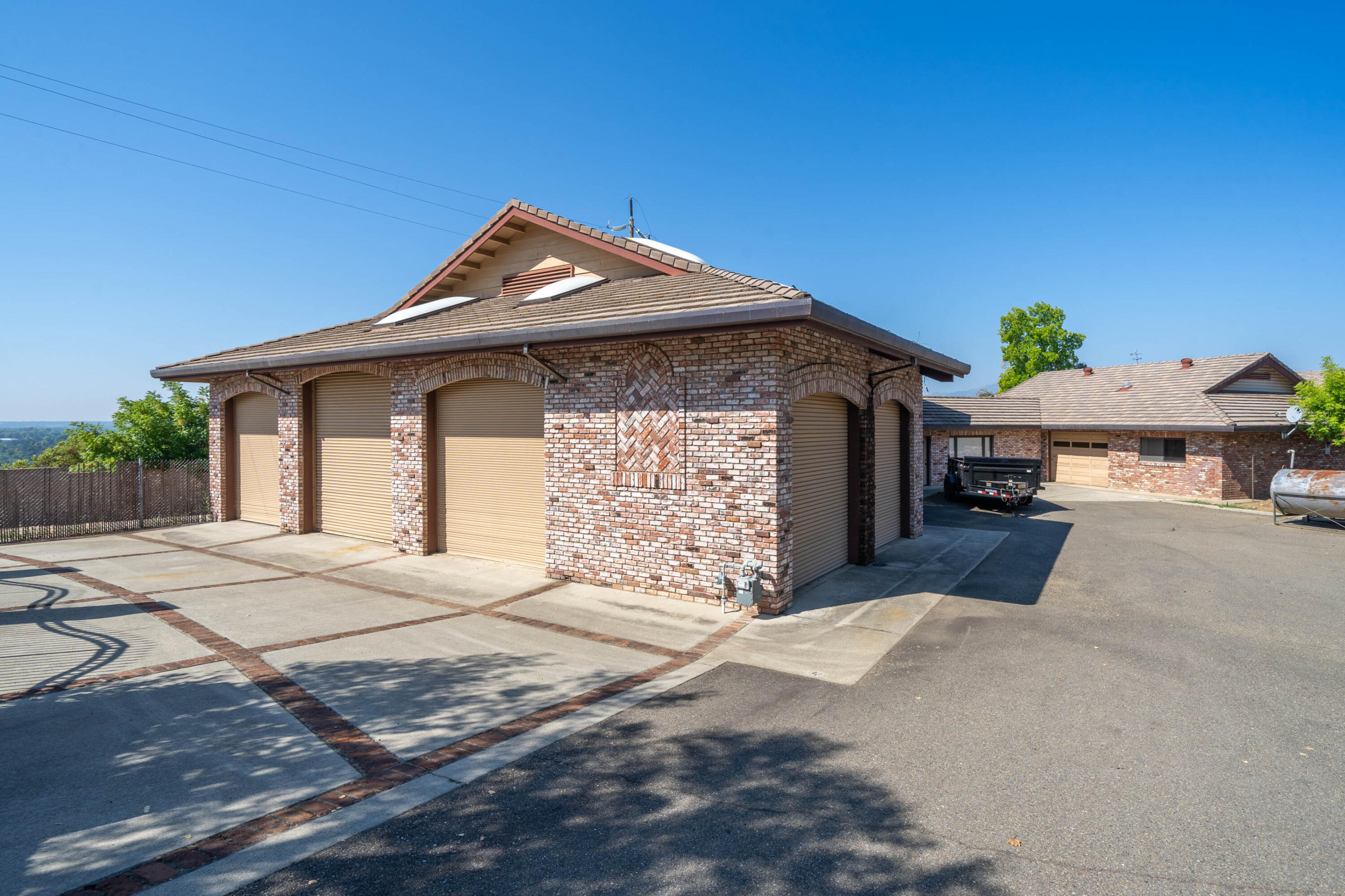 910 River Bend Road Redding, CA 96003 - Photo 42 of 92 a front view of a house with a yard and garage