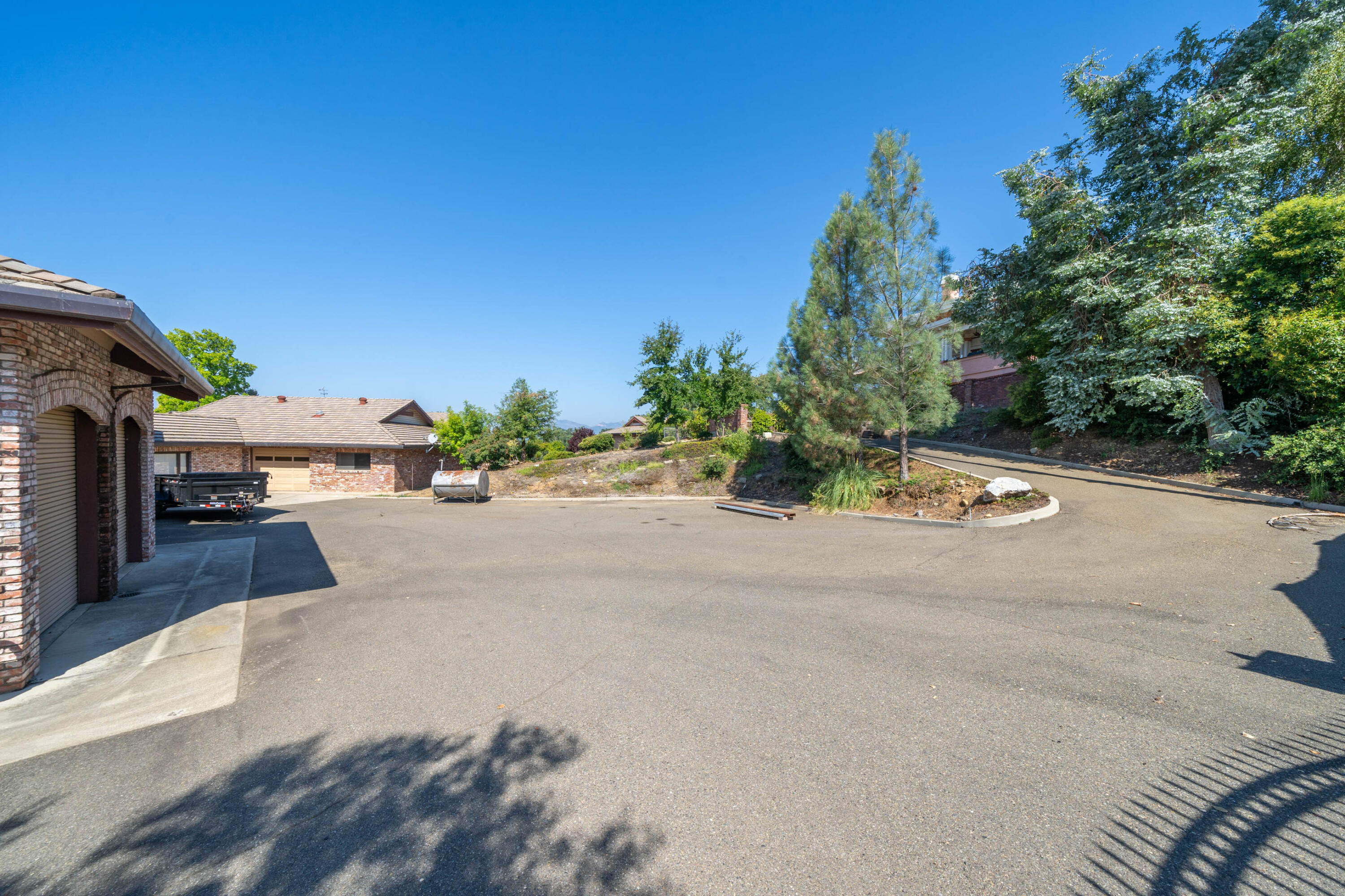 910 River Bend Road Redding, CA 96003 - Photo 43 of 92 a view of a street with a building and trees in the background
