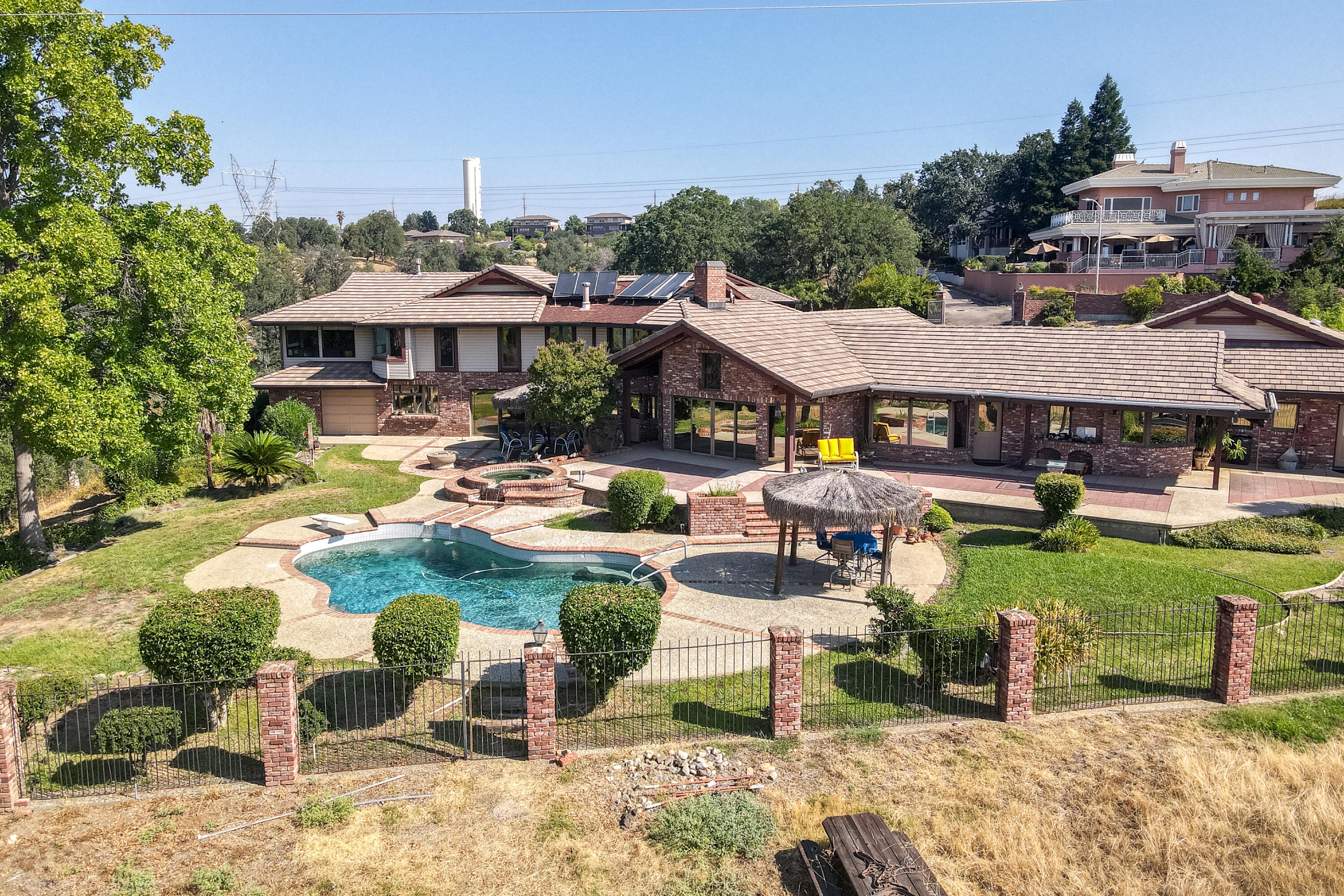 910 River Bend Road Redding, CA 96003 - Photo 5 of 92 a view of a patio with table and chairs under an umbrella
