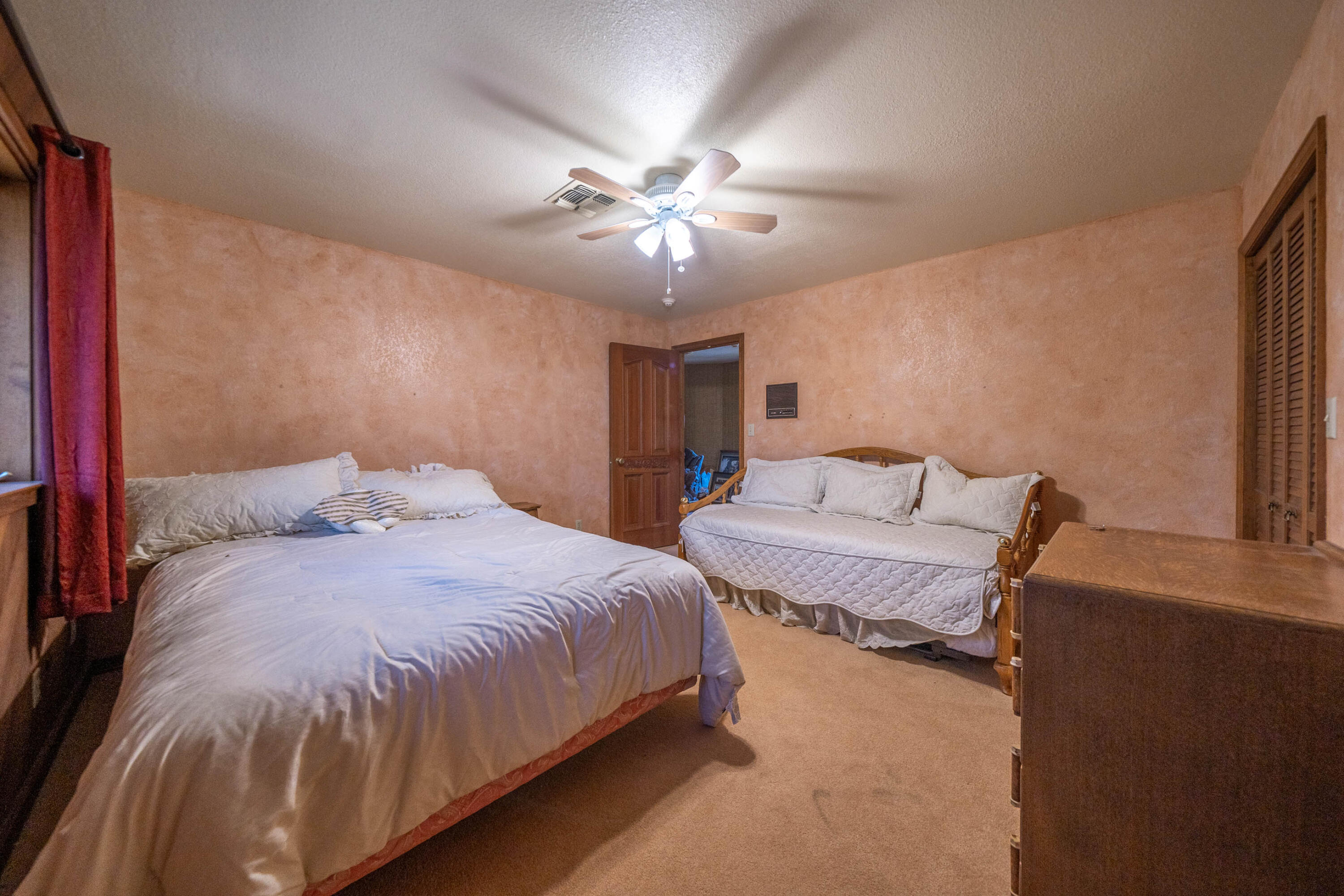 910 River Bend Road Redding, CA 96003 - Photo 64 of 92 a bedroom with bed and window