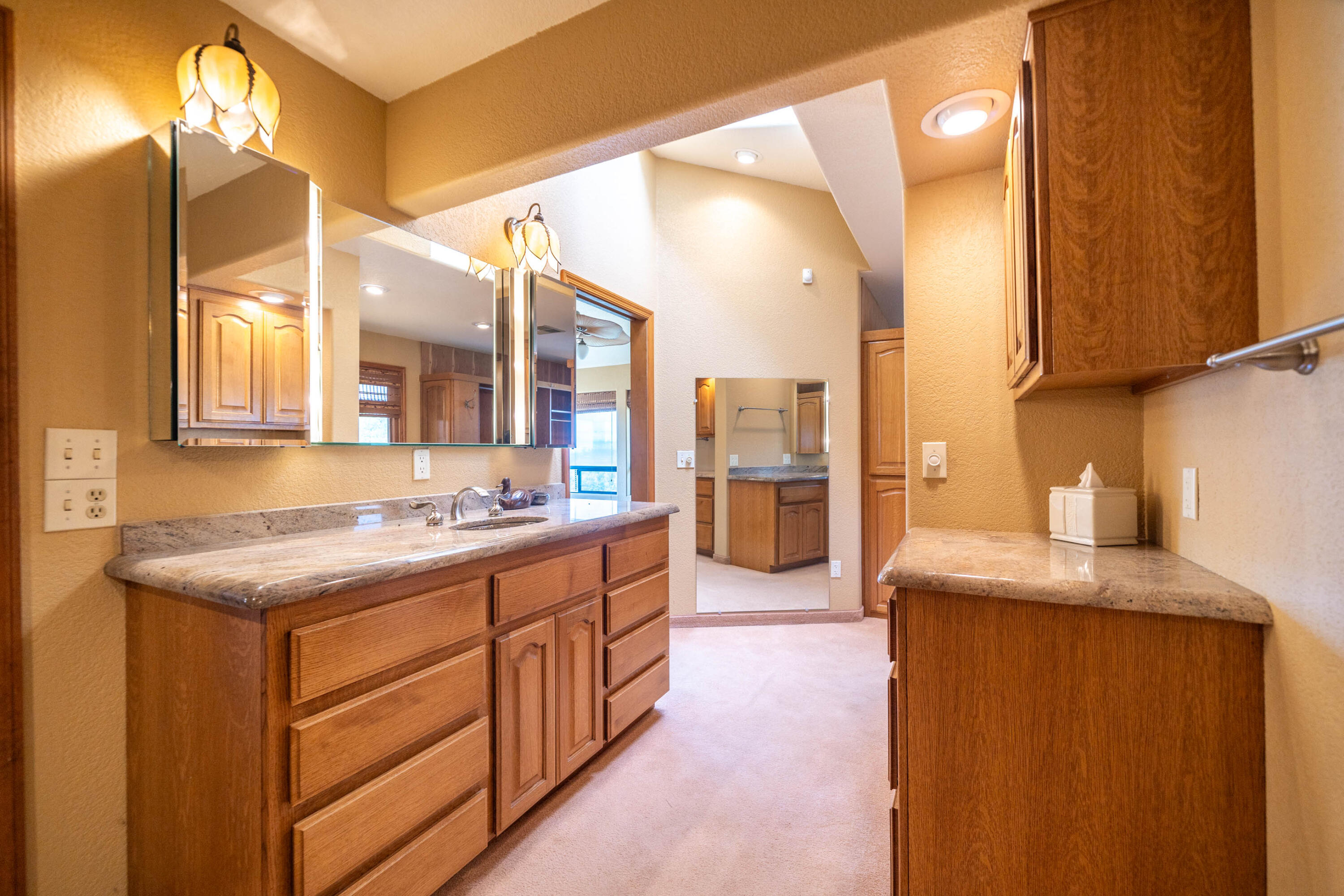 910 River Bend Road Redding, CA 96003 - Photo 75 of 92 a kitchen with stainless steel appliances granite countertop a sink and a refrigerator