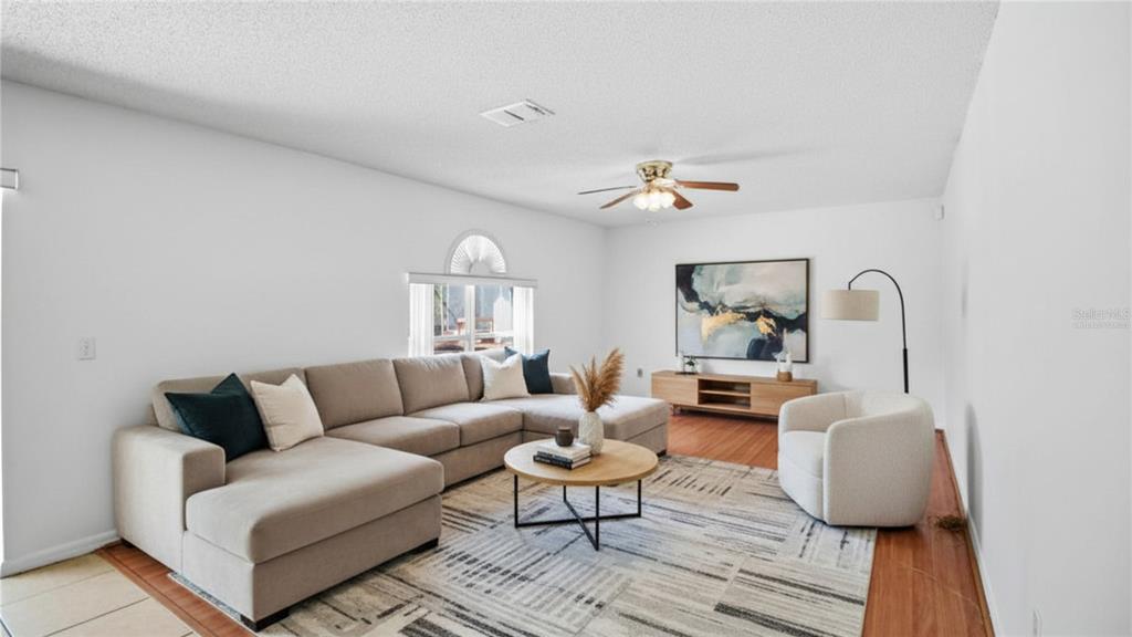 206 Taranto Way Kissimmee, FL 34758 - Photo 9 of 45 a living room with furniture
