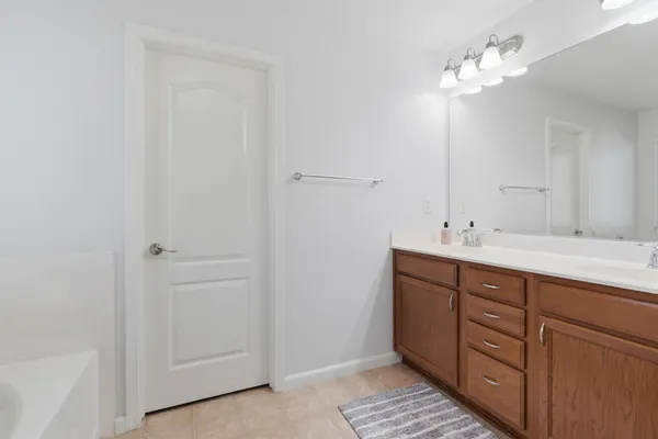 a white bath tub sitting next to a window