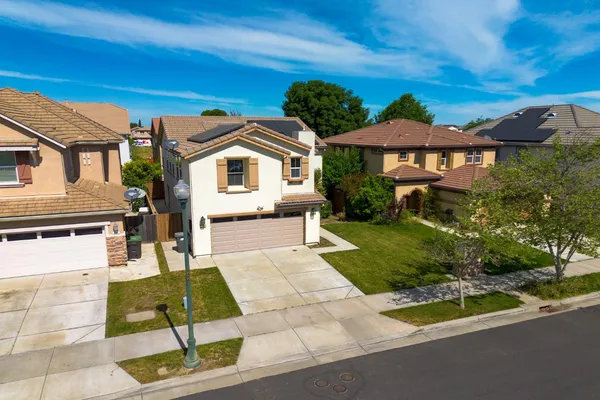 an aerial view of a house with a garden