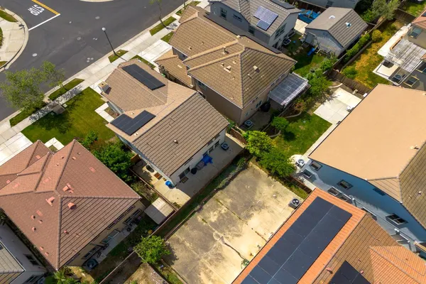 an aerial view of a house with a yard