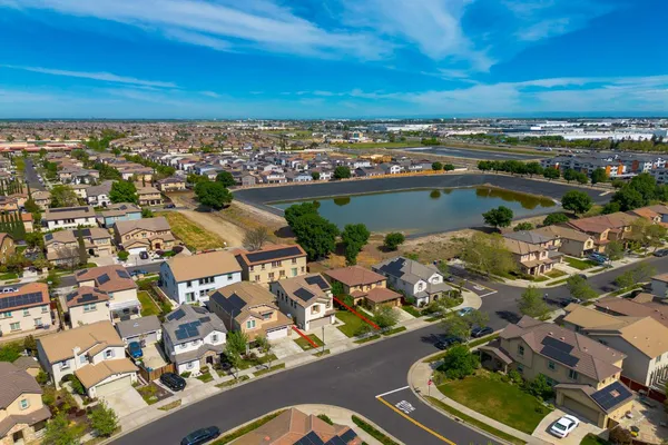 an aerial view of a city with lots of residential buildings