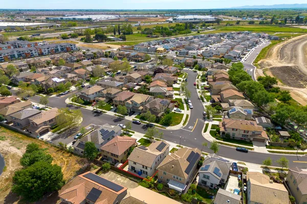 an aerial view of residential houses with outdoor space