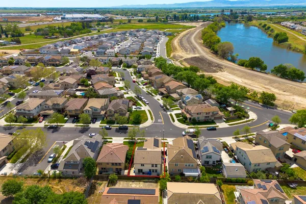 an aerial view of residential houses with outdoor space
