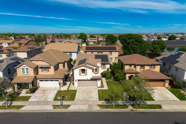 an aerial view of a house with a garden