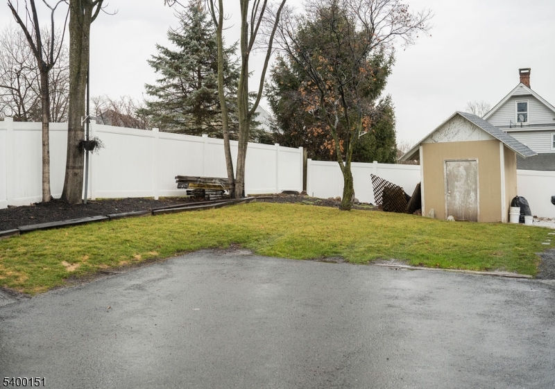 34 Ashwood Avenue, Unit 2 Summit, NJ 07901 - Photo 15 of 16 a view of a house with a big yard and large tree