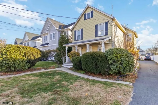 a view of a front of a house with a yard