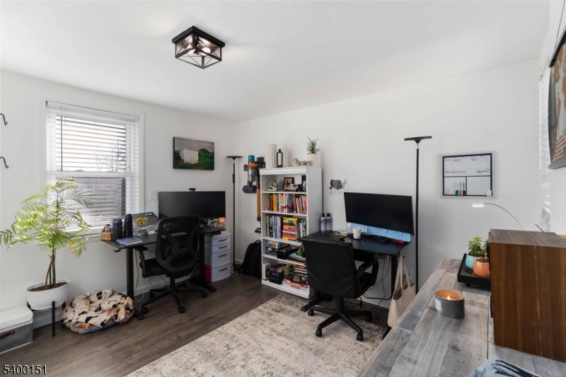 34 Ashwood Avenue, Unit 2 Summit, NJ 07901 - Photo 4 of 16 a view of a workspace with furniture and a window