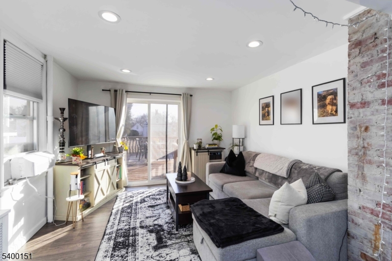 34 Ashwood Avenue, Unit 2 Summit, NJ 07901 - Photo 5 of 16 a living room with furniture and a window