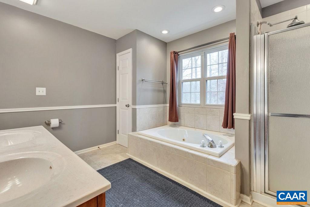 38 Amethyst Road Palmyra, VA 22963 - Photo 18 of 45 a bathroom with a tub and a sink