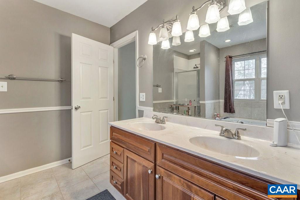 38 Amethyst Road Palmyra, VA 22963 - Photo 20 of 45 a bathroom with a sink vanity granite and a mirror