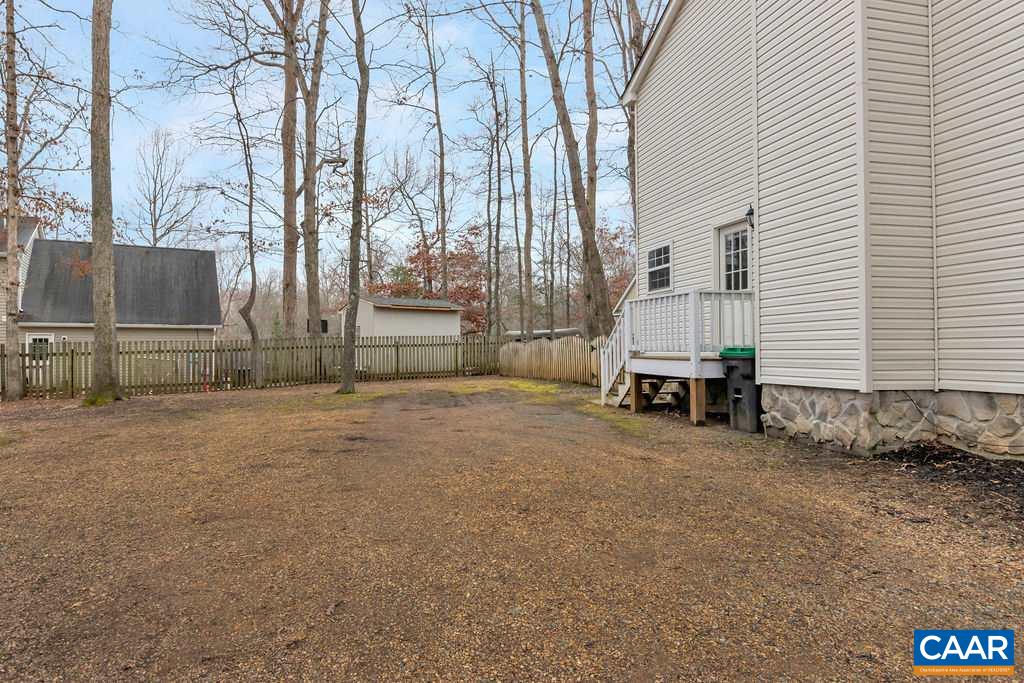 38 Amethyst Road Palmyra, VA 22963 - Photo 30 of 45 a view of a backyard with large trees