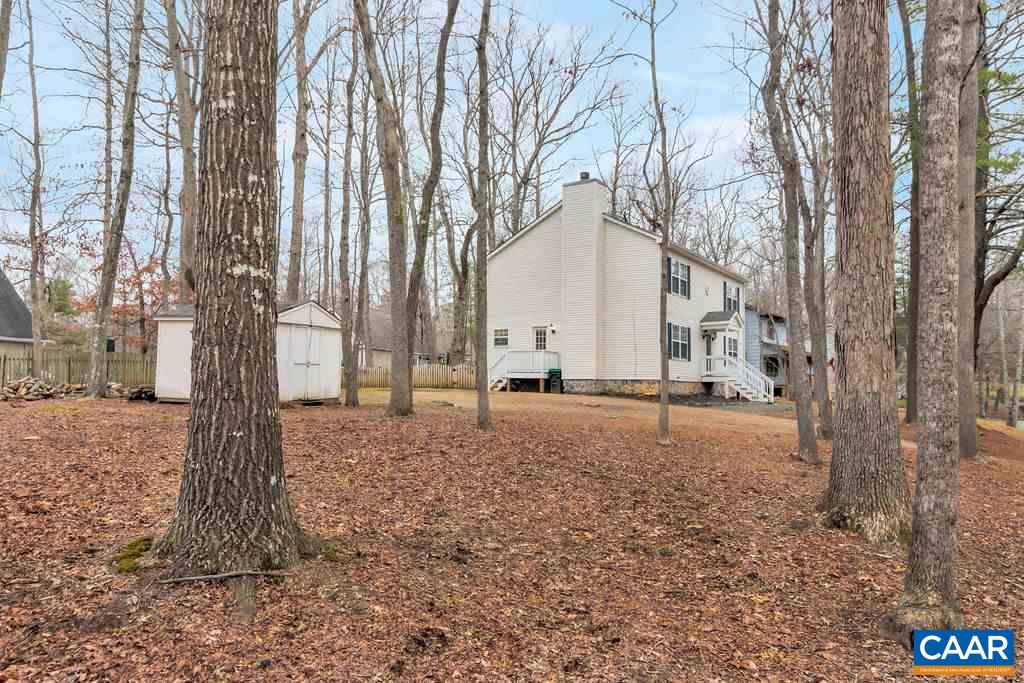 38 Amethyst Road Palmyra, VA 22963 - Photo 31 of 45 a backyard of a house with lots of green space