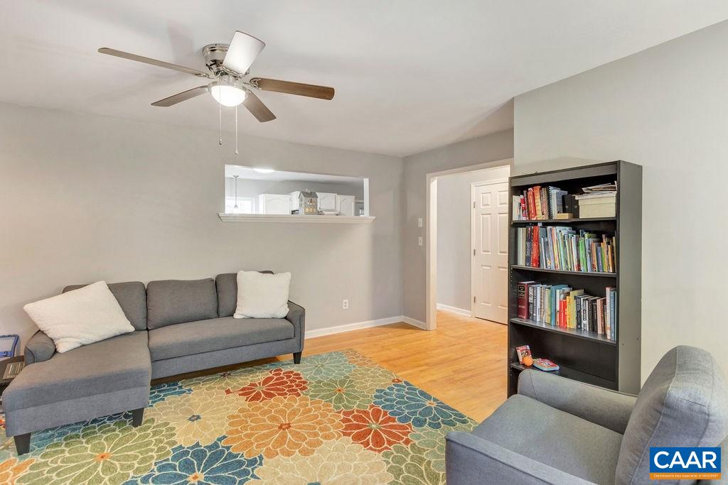 38 Amethyst Road Palmyra, VA 22963 - Photo 6 of 45 a living room with furniture and a book shelf