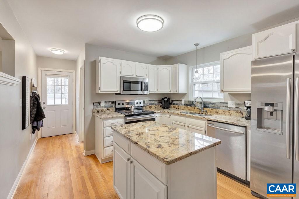 38 Amethyst Road Palmyra, VA 22963 - Photo 7 of 45 a kitchen with a sink a counter top space appliances and cabinets