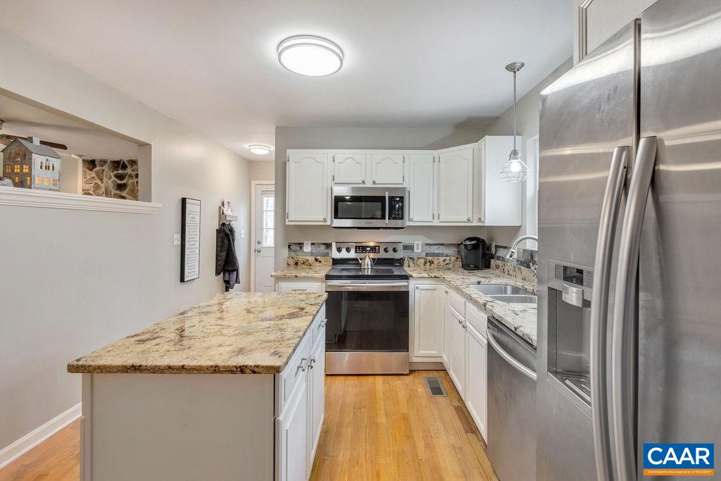 38 Amethyst Road Palmyra, VA 22963 - Photo 8 of 45 a kitchen with stainless steel appliances granite countertop a refrigerator a stove and a sink