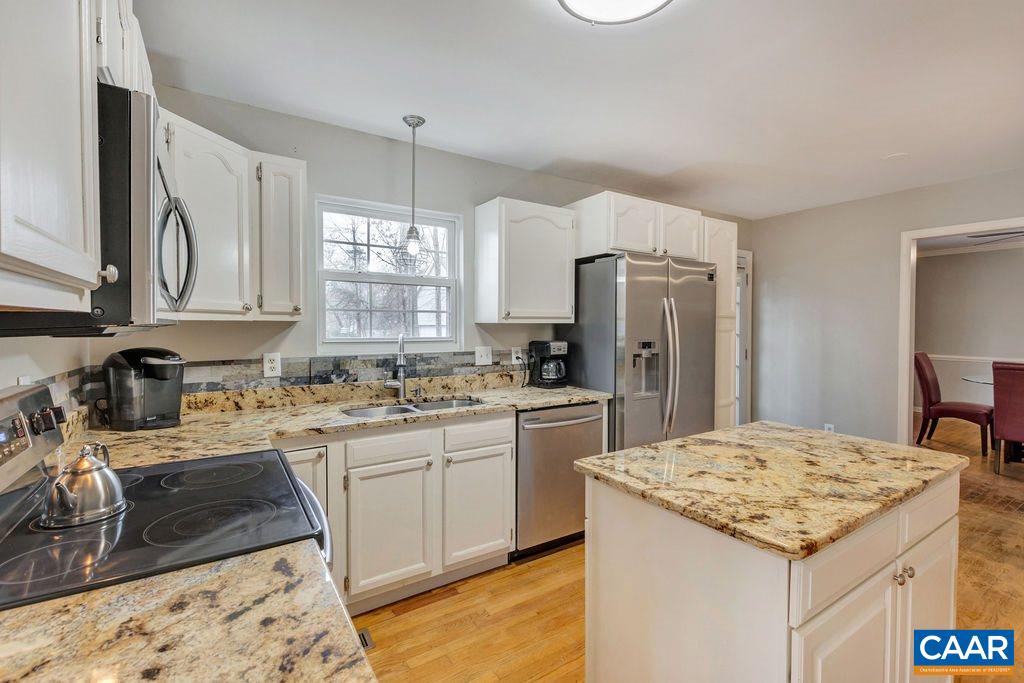 38 Amethyst Road Palmyra, VA 22963 - Photo 9 of 45 a kitchen with a sink stove and refrigerator