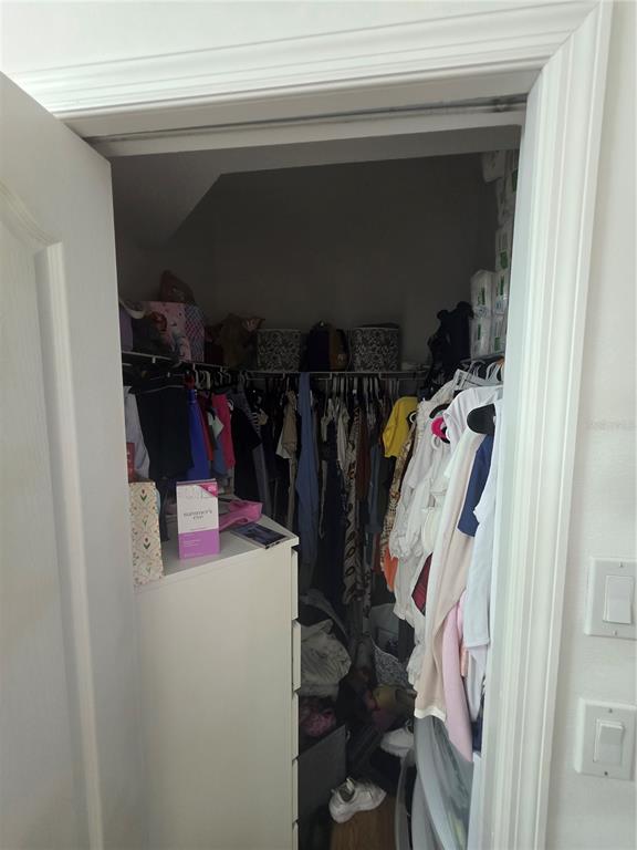 17820 Monteverde Drive Spring Hill, FL 34610 - Photo 27 of 42 a view of walk in closet with clothes and shoes