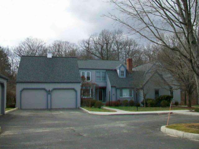 50 Gate Ridge Road, Unit 50 Fairfield, CT 06825 - Photo 1 of 1 a front view of a house with a yard and garage