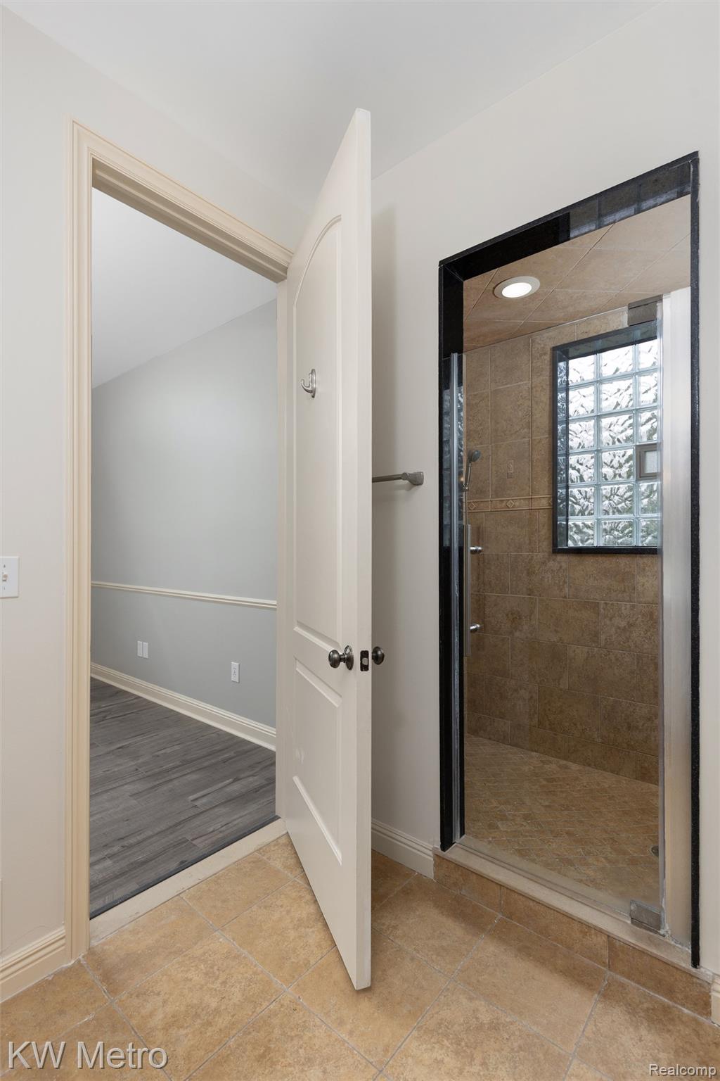65884 Windrose Court Ray, MI 48096 - Photo 50 of 82 Full bath with a shower stall and baseboards