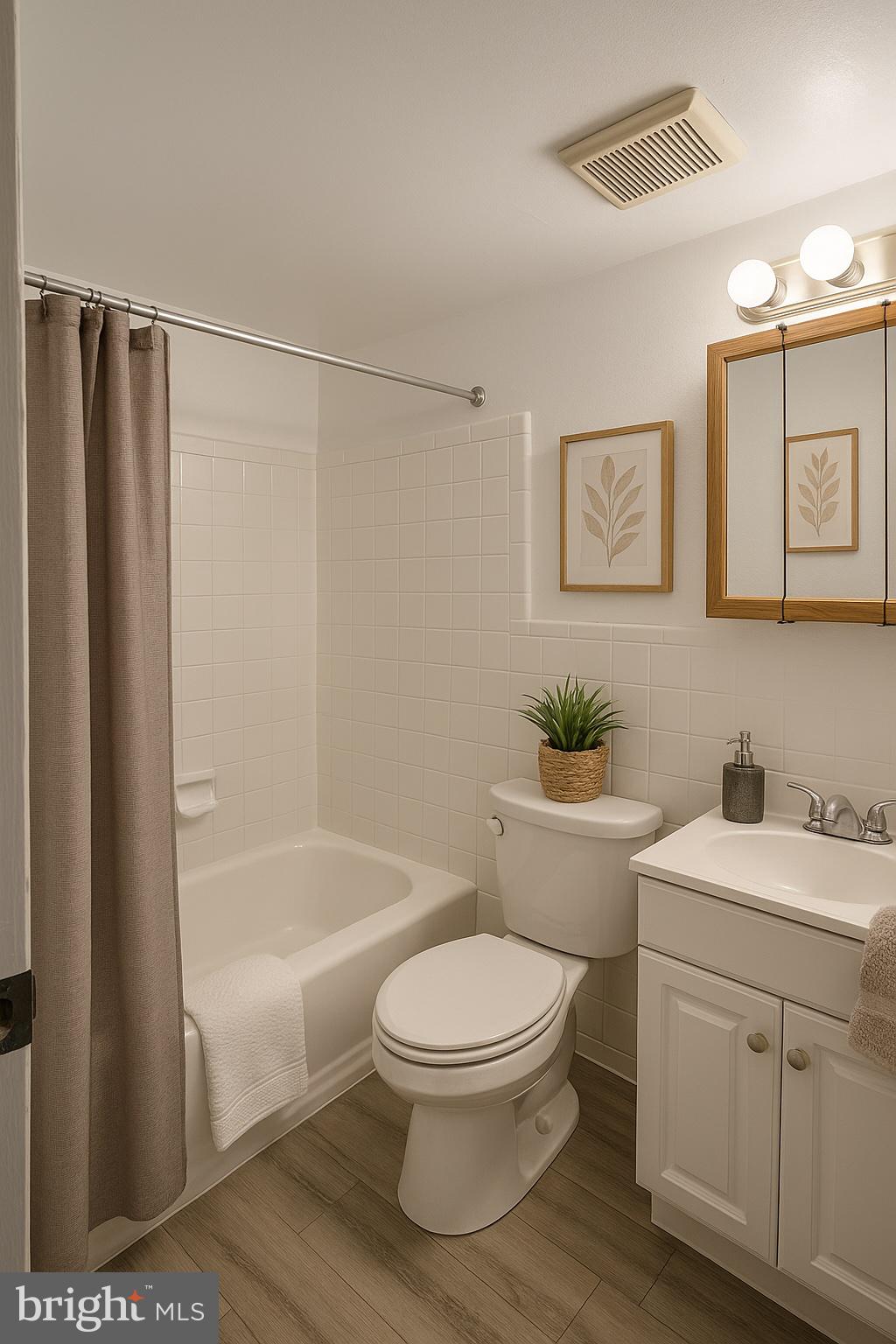 4616 Leiper Street, Unit A9 Philadelphia, PA 19124 - Photo 7 of 11 a bathroom with a toilet a sink and bathtub