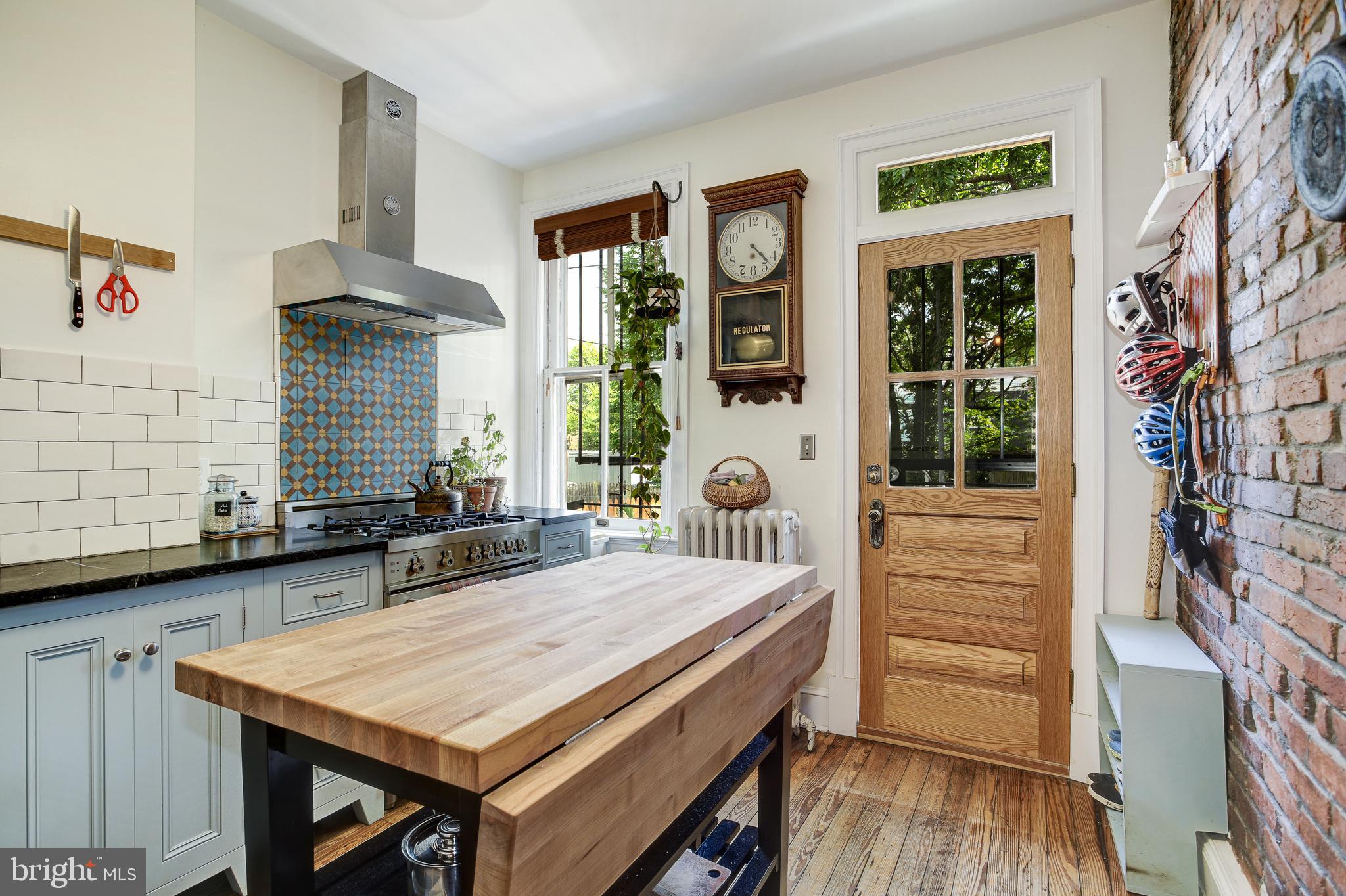 1511 D Street Southeast Washington, DC 20003 - Photo 16 of 29 Exposed brick wall and original floors - LOVE
