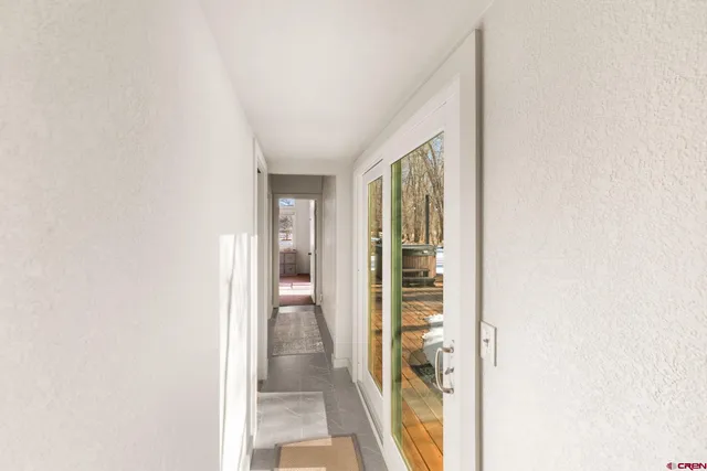 a bedroom with two beds and a couch