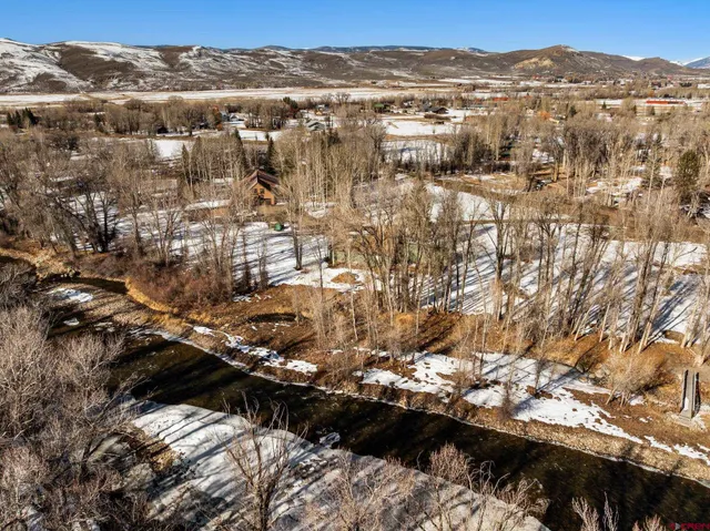 an aerial view of residential building with parking space