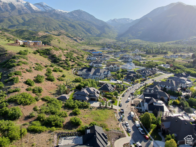 1319 Eastview Lane, Unit 214 Alpine, UT 84004 - Photo 1 of 8 Aerial perspective of suburban area with a mountain backdrop