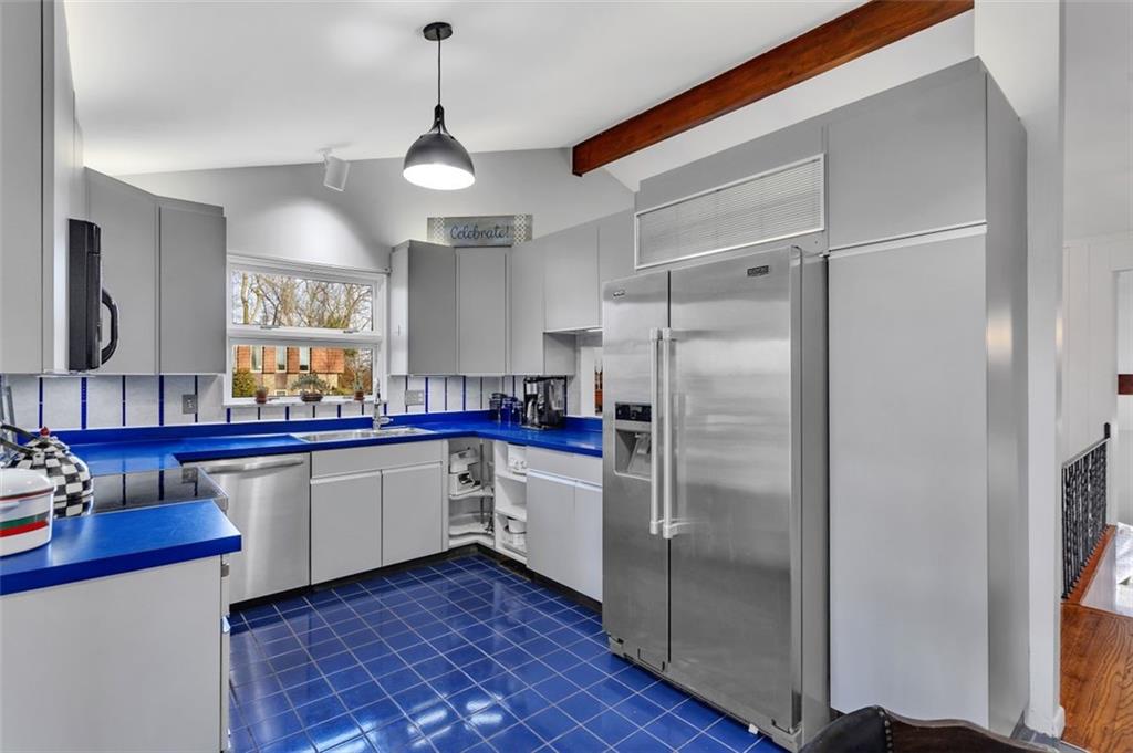 346 Churchill Road Pittsburgh, PA 15235 - Photo 14 of 40 a kitchen with stainless steel appliances a refrigerator sink and cabinets