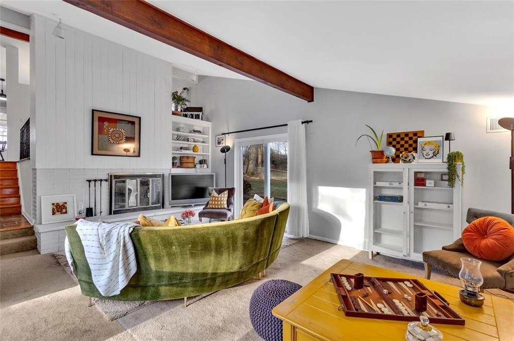 346 Churchill Road Pittsburgh, PA 15235 - Photo 19 of 40 a living room with furniture and a wooden floor