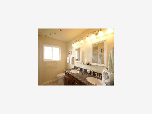 1807 Randall Road San Mateo, CA 94402 - Photo 8 of 9 a bathroom with a sink double vanity and mirror
