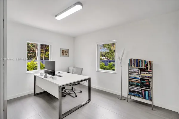 a workspace with furniture and a window