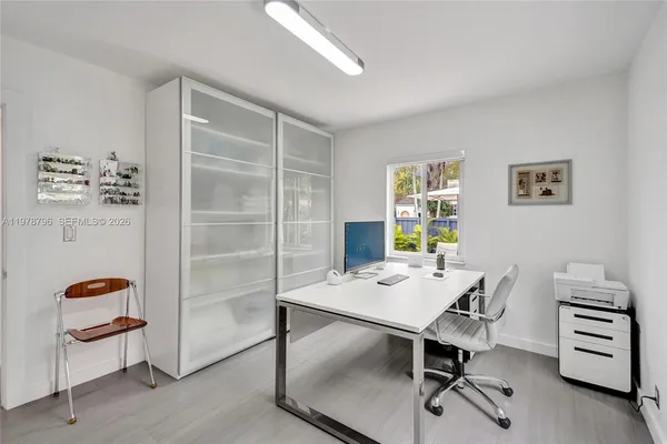 a workspace with furniture and window