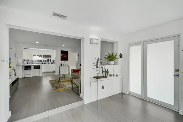 a view of a living room and a wooden floor