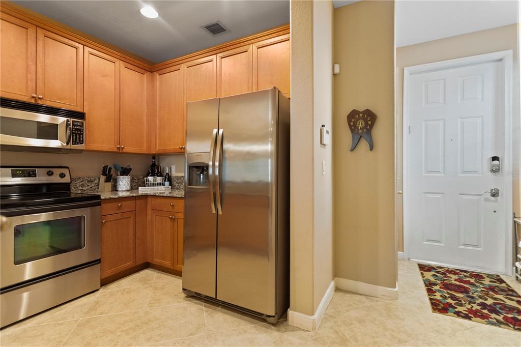 4650 Southwest 75th Way Davie, FL 33314 - Photo 16 of 57 a kitchen with stainless steel appliances granite countertop a refrigerator and a stove top oven
