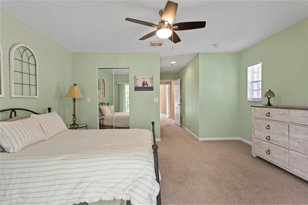 4650 Southwest 75th Way Davie, FL 33314 - Photo 34 of 57 a bedroom with a large bed and a chandelier