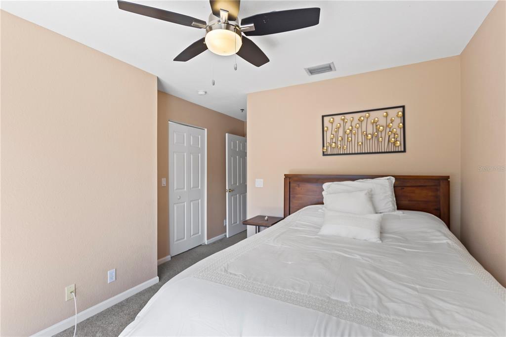 4650 Southwest 75th Way Davie, FL 33314 - Photo 45 of 57 a bedroom with a large bed and a chandelier