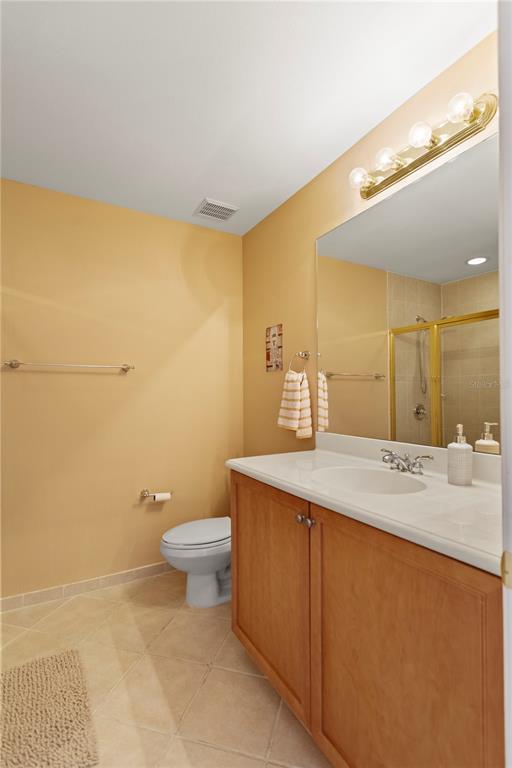 4650 Southwest 75th Way Davie, FL 33314 - Photo 46 of 57 a bathroom with a granite countertop sink a toilet and a mirror